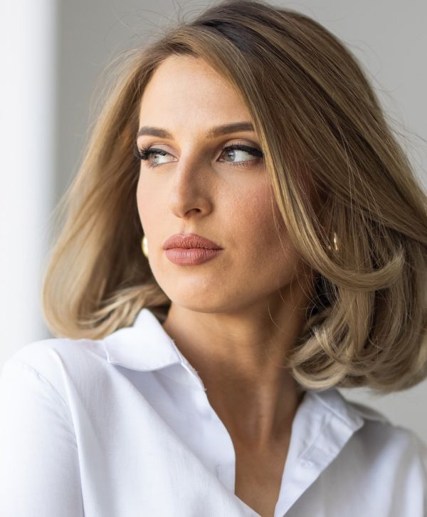 xeomin patient model in a white button up shirt