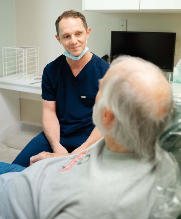 madison dentist Dr. Paul Wehner consulting with a bone grafting patient